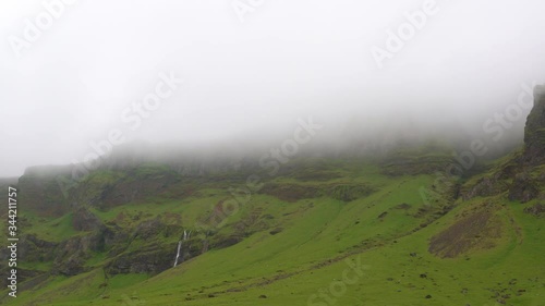 Tiny waterfalls in the fog on the Skoda river. Iceland