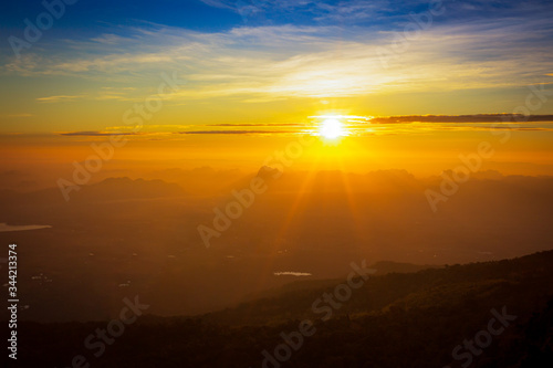 Beautiful sunrise over the mountains image for background, wallpaper, interior.,Mountain landscape,Sunrise over mountain © banjongseal324