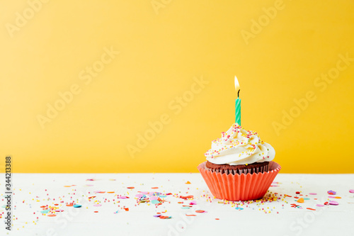 Sticker Colorful cupcake for birthday party on yellow background