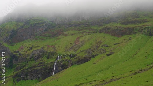Tiny waterfalls in the fog on the Skoda river. Iceland