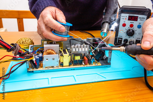 Repairing electrical cable with soldering iron