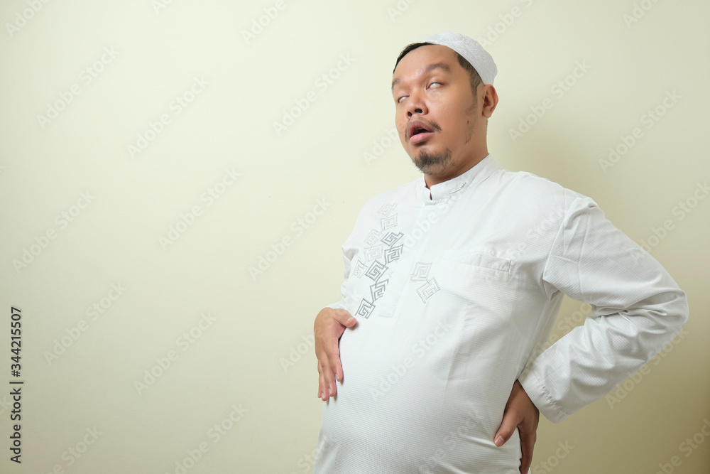 Asian Muslim men feel very full after eating Asian Muslim men feel very full after eating