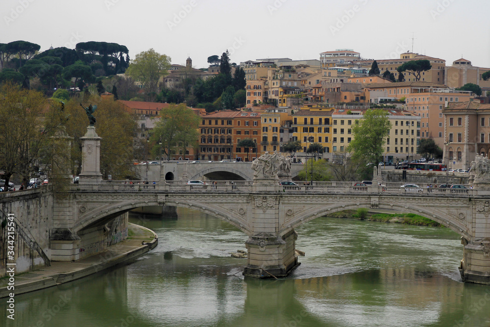 A tranquil scene of water under a bridge in Rome, Italy