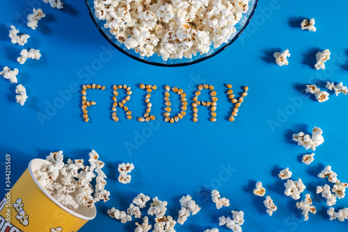 Blue background of popcorns cinema friday.