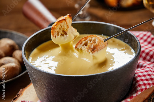 Pot of traditional Swiss cheese fondue photo