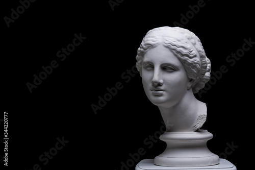 Gypsum copy of ancient white statue of bust of Venus with black background .Plaster sculpture woman face. The goddess of love in Greek mythology. Renaissance epoch.