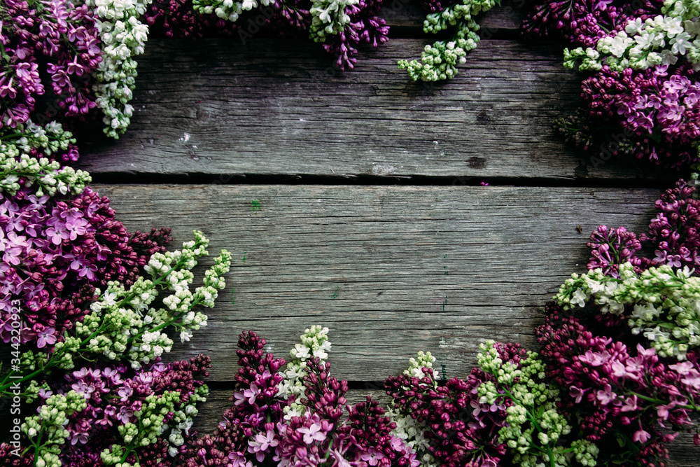 Lilac flowers on a wooden background. Free space