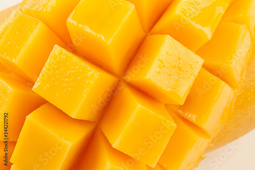 Closeup detail cut slice of ripe mango fruit