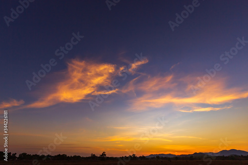 sunset over silhouette mountain countryside 