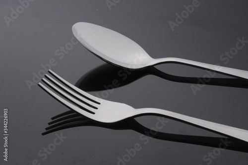 fork and spoon, fork and spoon on gray background, spoon and fork isolated on a gray background.