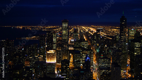 CHICAGO, ILLINOIS, UNITED STATES - DEC 11th, 2015: Aerial view of Chicago downtown at night from John Hancock skyscraper high above