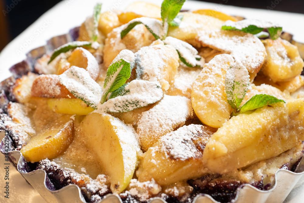 Juicy banana pie. Delicious Thanksgiving apple pie with mint or basil. Baking in the oven. Pie with banana. Sweet cupcake with baked fruit sprinkled with powder. Juicy banana pie. Delicious Thanksgiving apple pie with mint or basil. Baking in the oven. Pie with banana. Sweet cupcake with baked fruit sprinkled with powder.