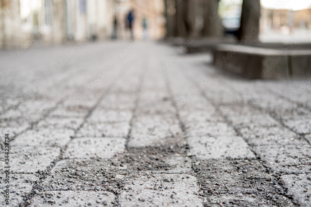 Obraz premium Cobblestone pavement is sprinkled with crushed granite, so that it is not slippery in the winter. Bottom view.