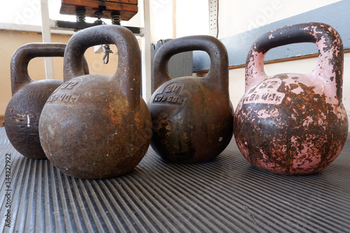 Old gym interior with old school dumbbells and equipment