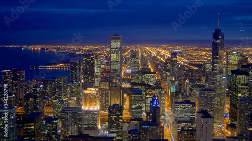 CHICAGO  ILLINOIS  UNITED STATES - DEC 11th  2015  Aerial view of Chicago downtown at night from John Hancock skyscraper high above