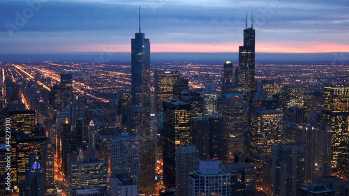 CHICAGO  ILLINOIS  UNITED STATES - DEC 11th  2015  Aerial view of Chicago downtown at twilight from John Hancock skyscraper high above