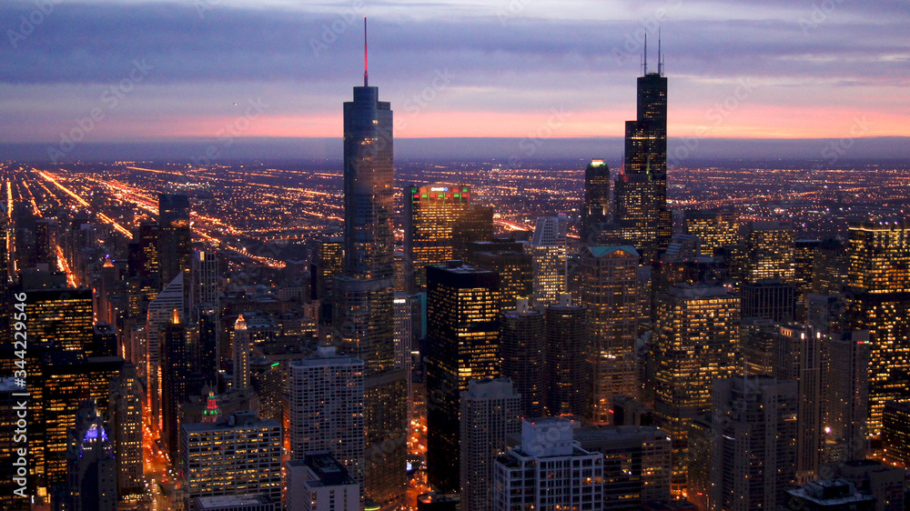 CHICAGO, ILLINOIS, UNITED STATES - DEC 11th, 2015: Aerial view of Chicago downtown at twilight from John Hancock skyscraper high above