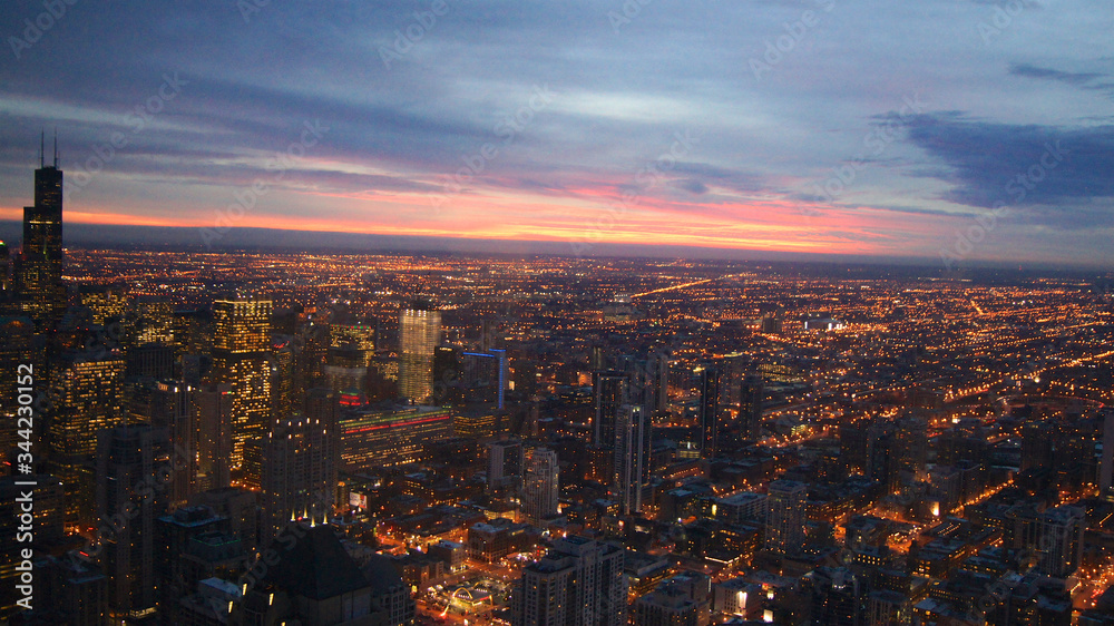 CHICAGO, ILLINOIS, UNITED STATES - DEC 11th, 2015: Aerial view of Chicago downtown at twilight from John Hancock skyscraper high above