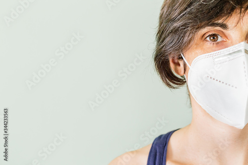 Portrait of a Caucasian woman wearing a protective mask against Coronavirus