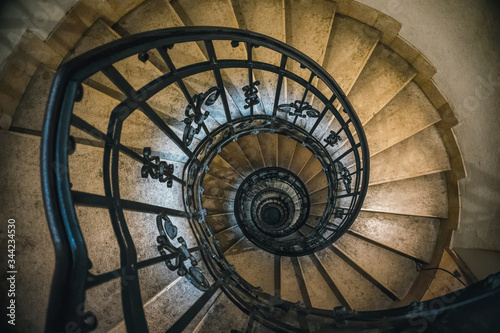 Antique stone spiral staircase in the tower of the bell tower of the Catholic Church 