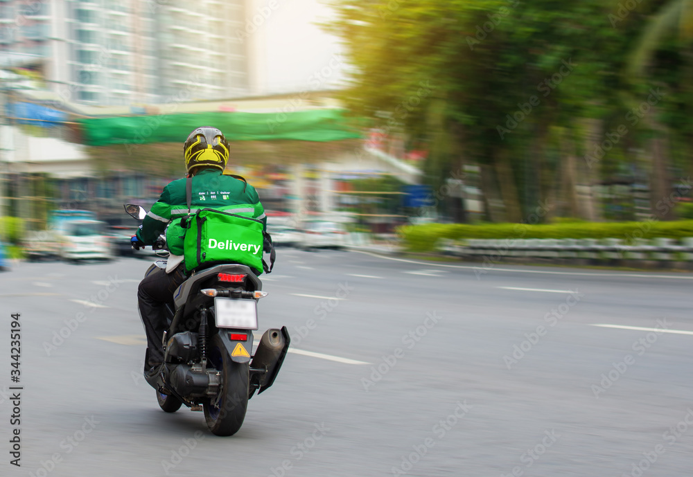 Motorcycle drivers rush to deliver food to customers who order online.
