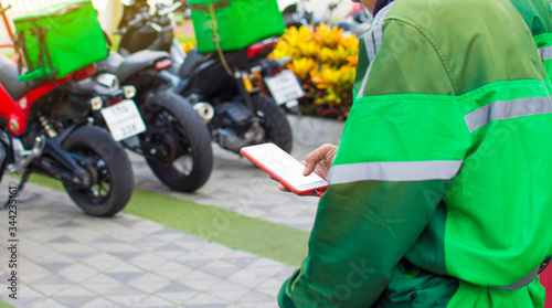 The driver sent food to wait for orders via mobile phone from customers who ordered online. Impact of epidemics
