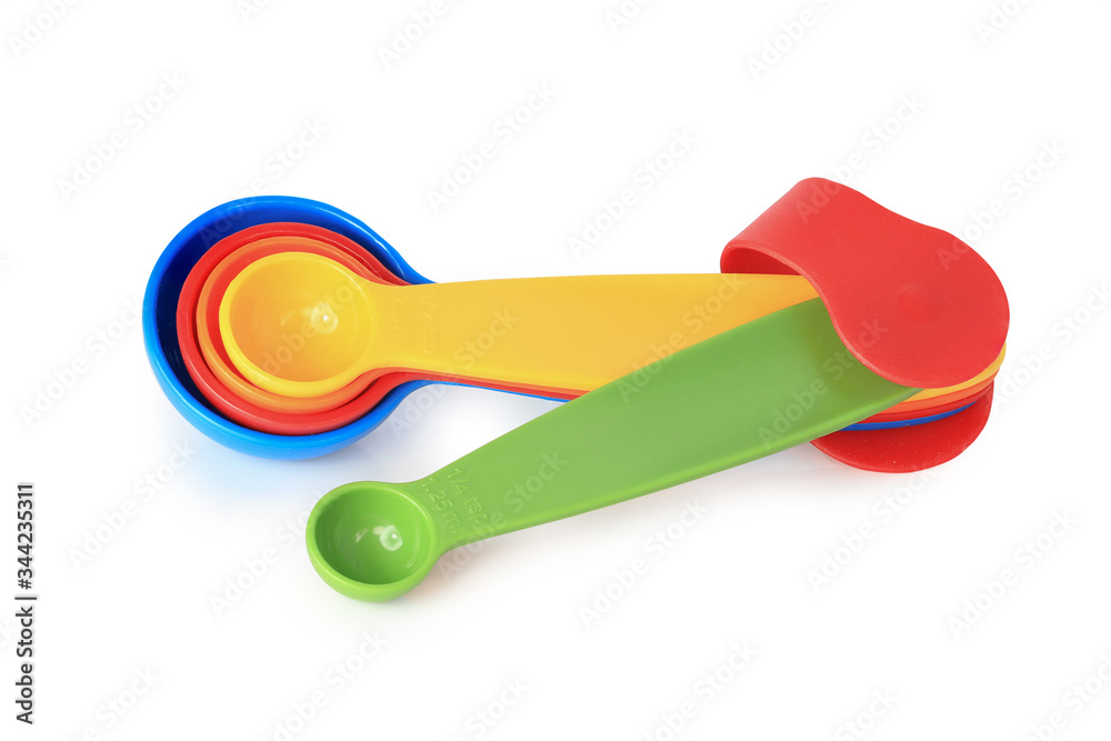 Colorful measuring spoons isolated on white background with clipping path.
