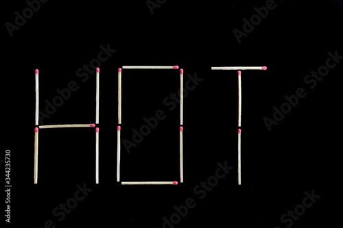 Hot writing with matches sticks isolated on black background