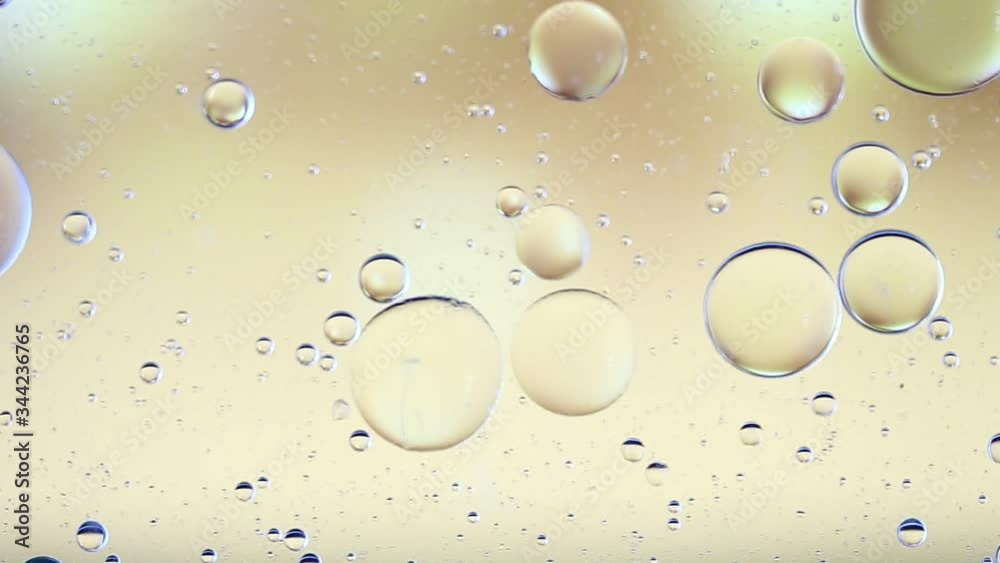 Colorful artistic image of oil drop floating on the water.