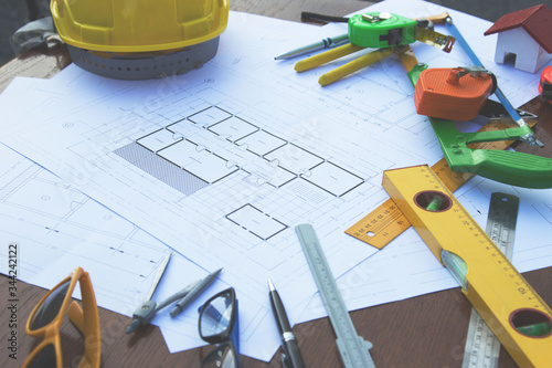 Architectural work site desk background construction project ideas concept, With drawing equipment.