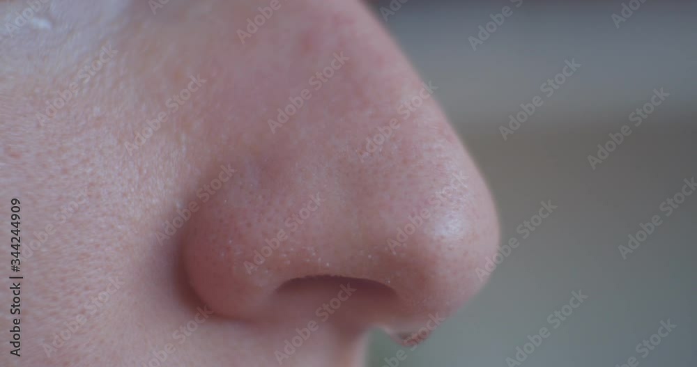 Close up girl nose with drop macro Close up girl nose with drop macro