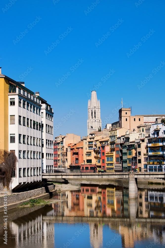 Colorful houses of Girona in center of city en embankment of Onyar River