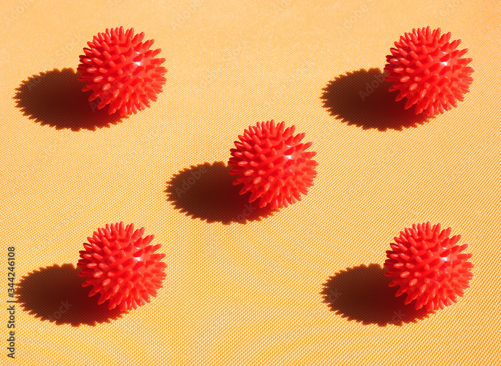 Fototapeta premium Red viruses covid19 fly on yellow background red bols with bright light and shadow