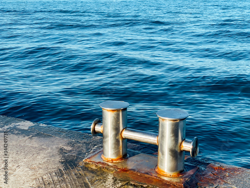 ship knecht for mooring at the pier by the sea photo