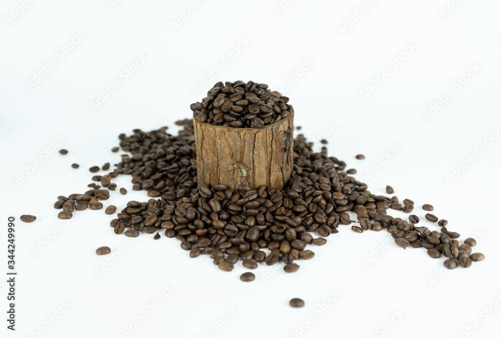 Coffee beans lying on small stump and around Coffee beans lying on small stump and around