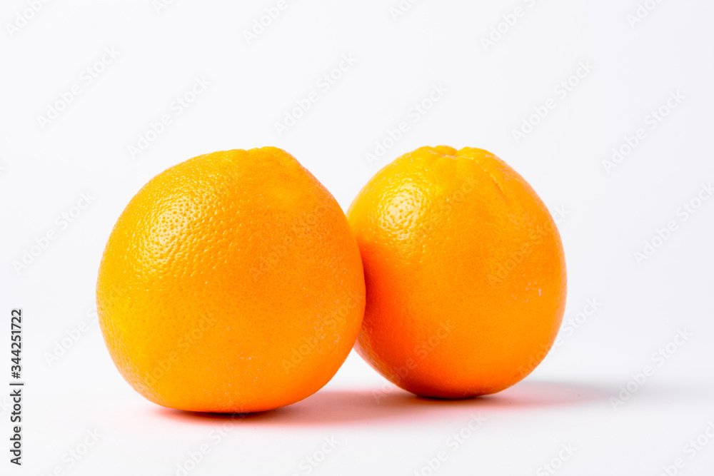 Portrait Of Two Oranges Against White Background Portrait Of Two Oranges Against White Background