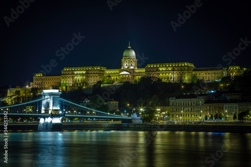 Buda Castle sits on a hill above the Danube River and The Chain Bridge in the capitol city of Budapest, Hungary