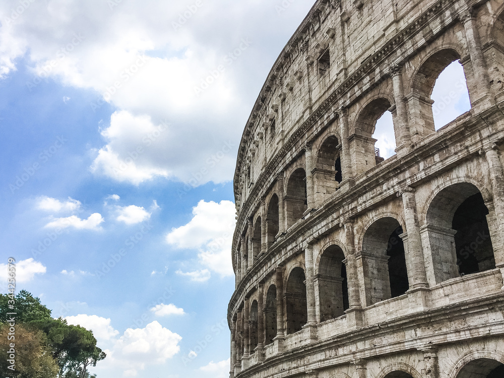 Photo of a Coloseum in Rome in Italy with a bright sky