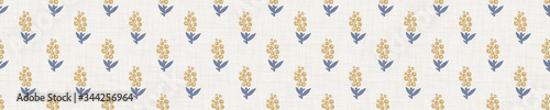
Seamless tossed floral pattern in french blue linen shabby chic style. Hand drawn country bloom texture. Rustic woven background. Kitchen towel home decor swatch. Simple flower motif all over print