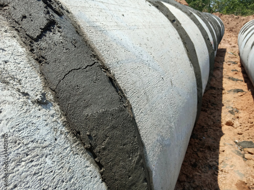 Wallpaper Mural Construction of drainage pipes and cement pouring for pipe connection Torontodigital.ca