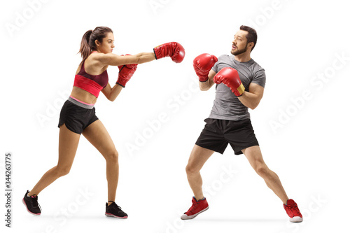 Young man and woman train boxing