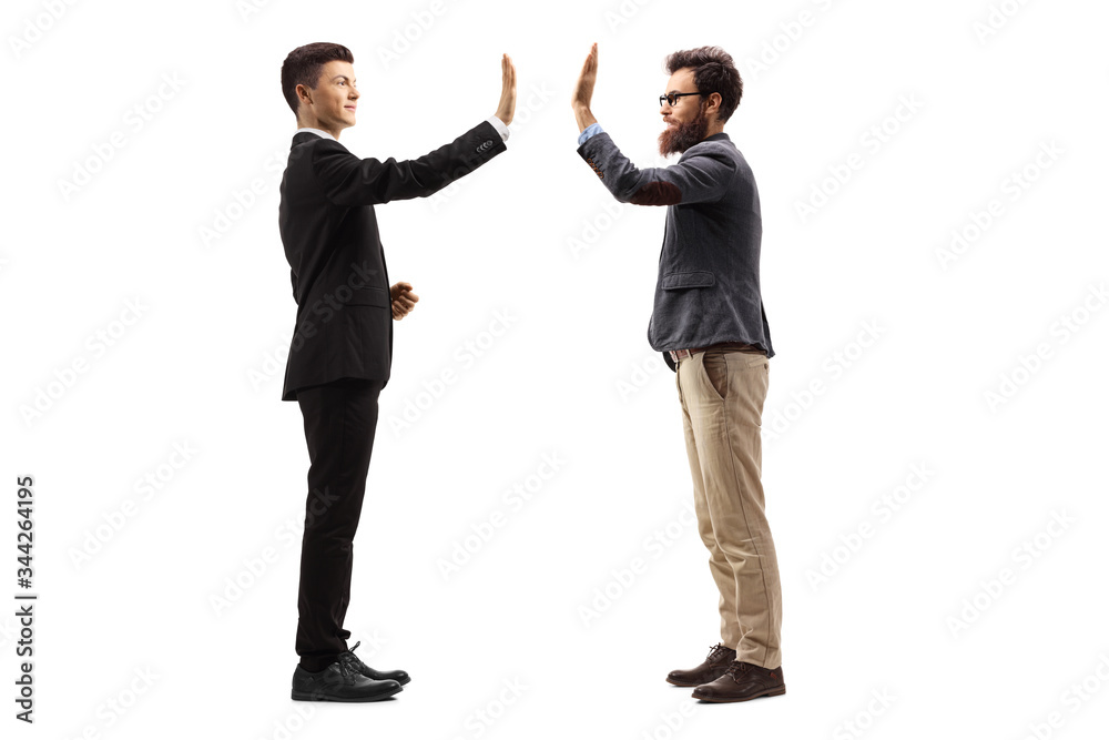 Young guy in a suit gesturing high-five with a bearded man