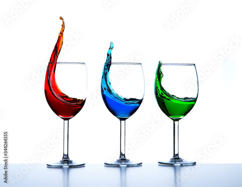 three wine glasses high speed pouring splash red green blue RGB colors 