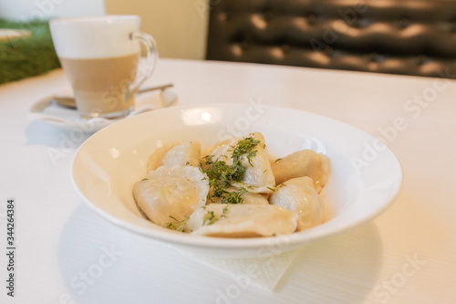 delicious dumplings with herbs and coffee