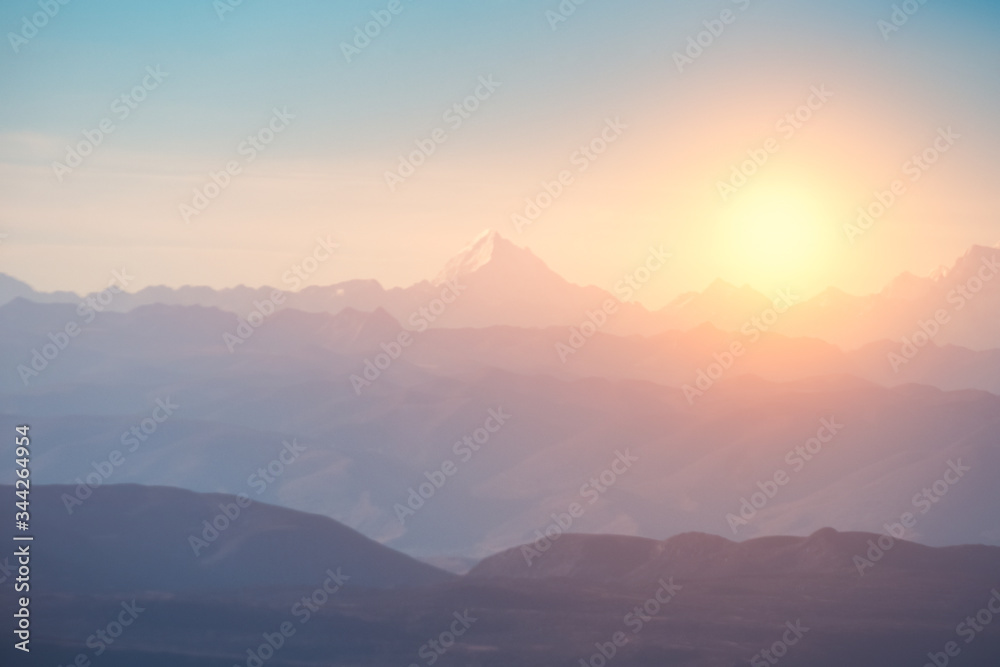Blurred of Peak on mountain range with sunrise at morning