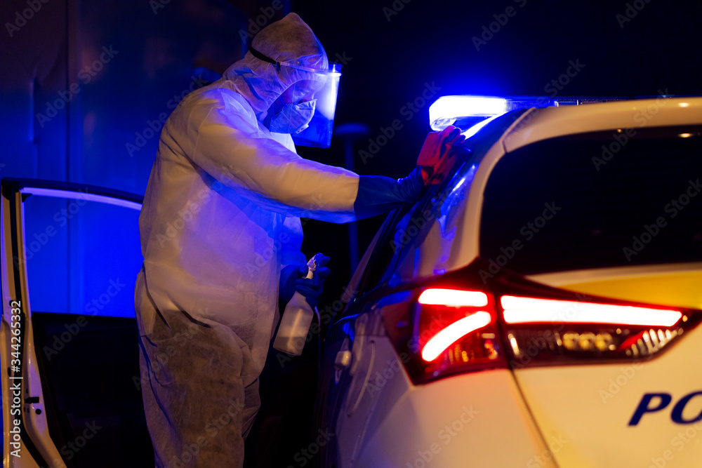 Police disinfecting the police vehicle due to Covid-19 pandemic Police disinfecting the police vehicle due to Covid-19 pandemic