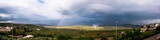 Panoramic view of a rainbow after the storm