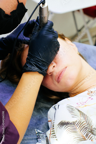 the eyebrow spraying process in the technique of powdery, nano permanent makeup.