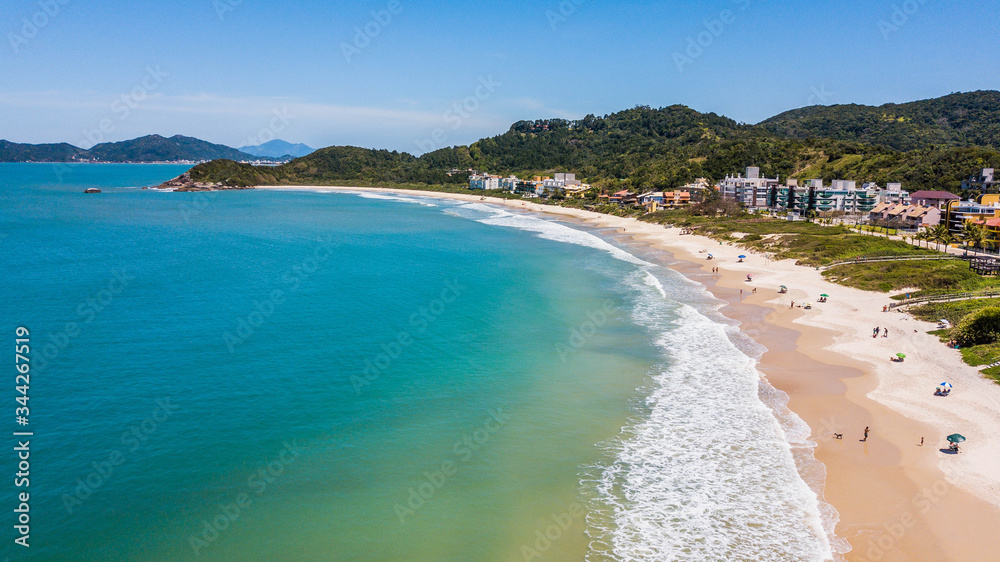 Bombinhas - SC - Brazil. View to Quatro Ilhas beach. Aerial panoramic view touristic beach of Bombinhas - Brazil