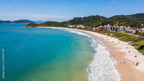 Bombinhas - SC - Brazil. View to Quatro Ilhas beach. Aerial panoramic view touristic beach of Bombinhas - Brazil